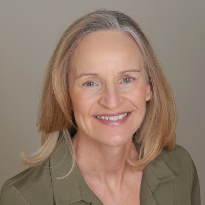 headshot of caucasian women in green shirt